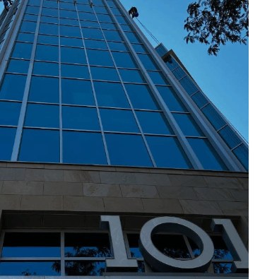 Floor-to-ceiling glass tower with crystal clear windows